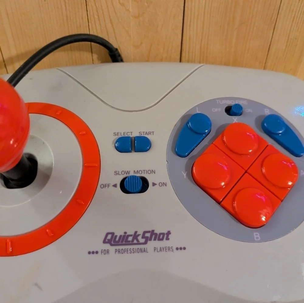 Gray and Red Joystick Controller